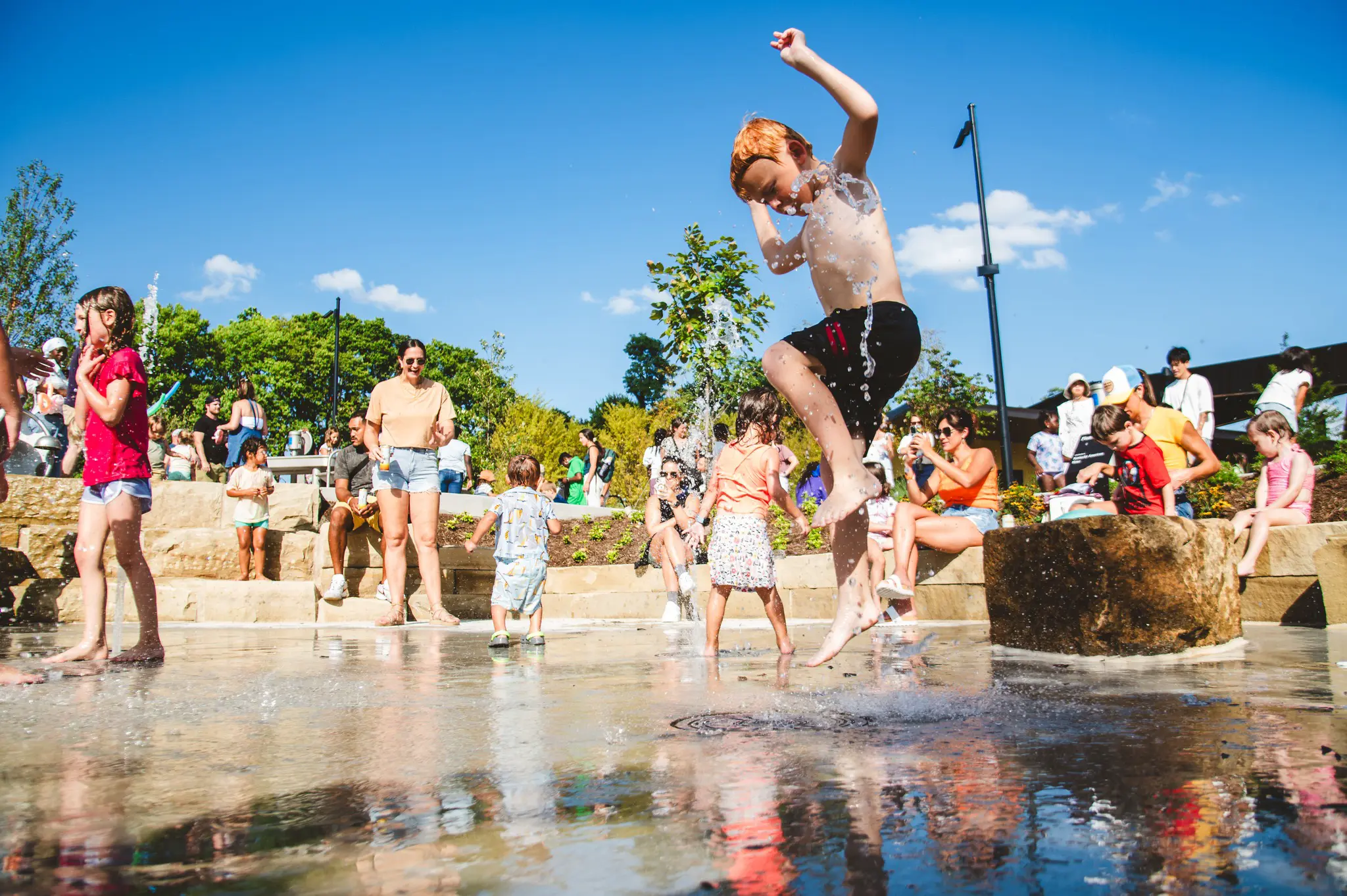 Kids playing in the splash pad at Gatton Park